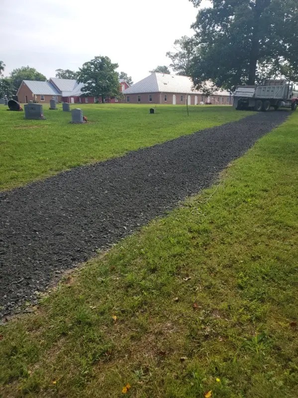 Fresh gravel path through a cemetery
